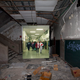 Illustration for article titled Composite photos show a Detroit school before and after it was abandoned